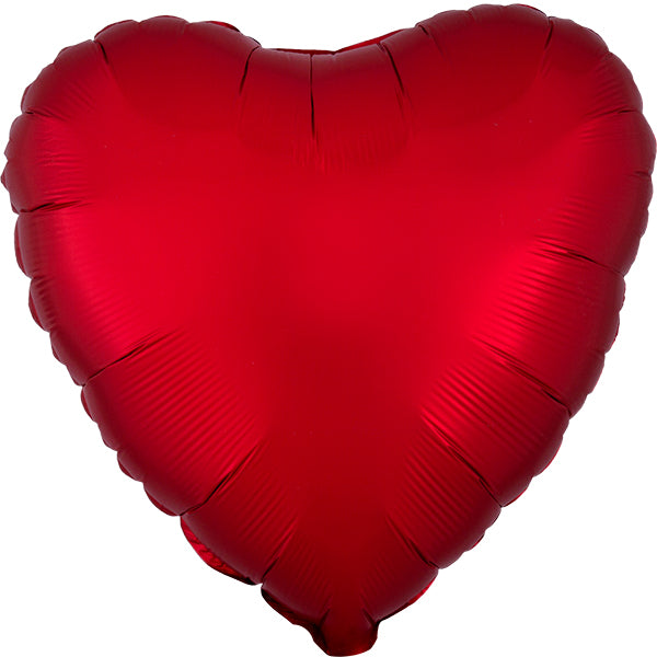 Red heart-shaped balloon on a white background