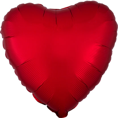 Red heart-shaped balloon on a white background